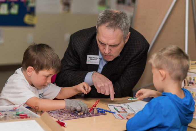 Ross Hunter, Secretary of the Department of Children, Youth, and Families, on a visit to a KidSpace Day Care program during his tenure as Director of Early Learning