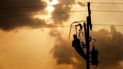 Silhouette of a power lineman 