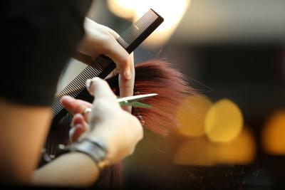 Stylist cutting hair