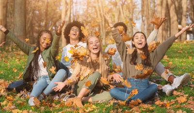 Youth playing the autumn leaves