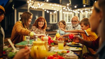 Large group eating at an outdoor table