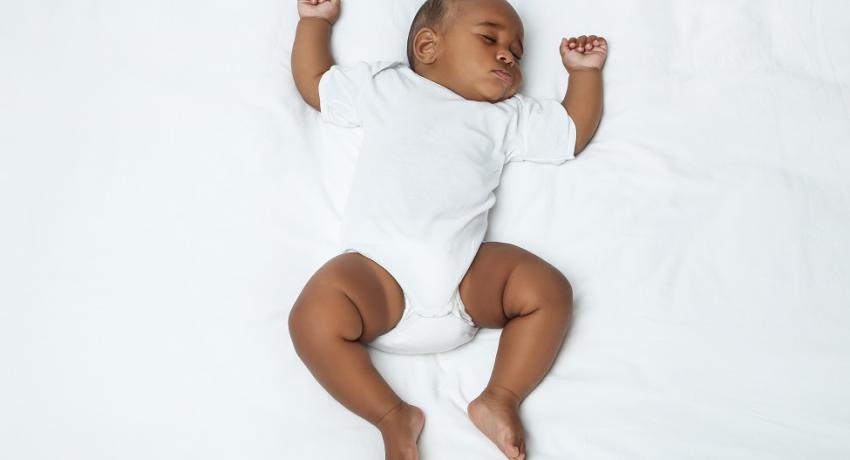baby girl in safe sleep environment