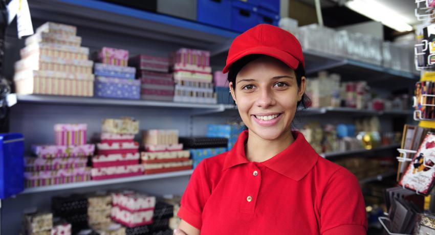 Young woman working in a retail setting.