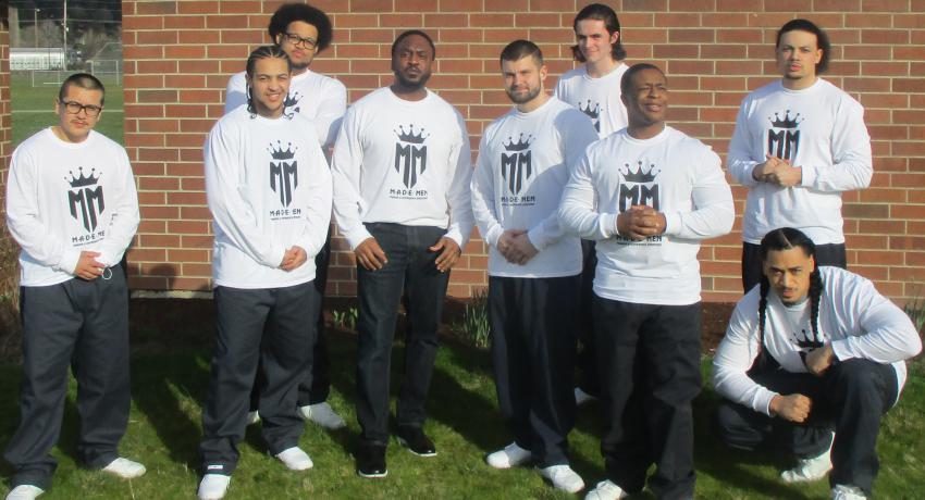 GHS's MADE Men peer mentors gather in branded t-shirts. 