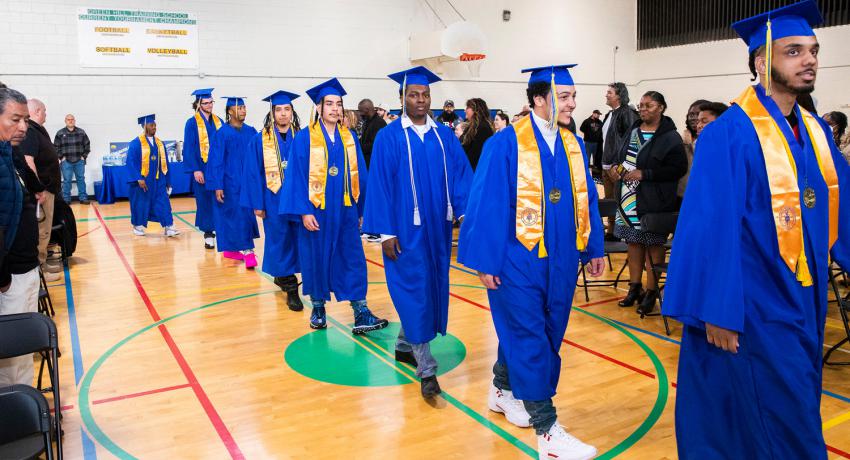 GHS youth walking the graduation aisle