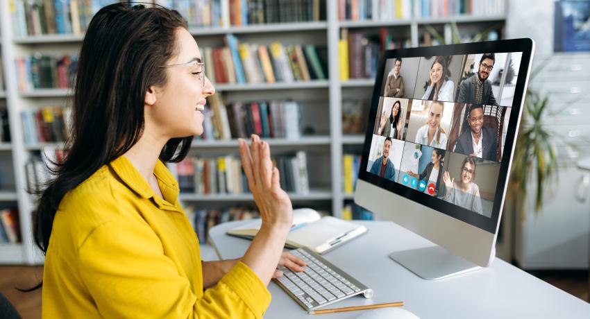 Women attending a meeting online. 