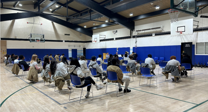 young people sitting in a Gym