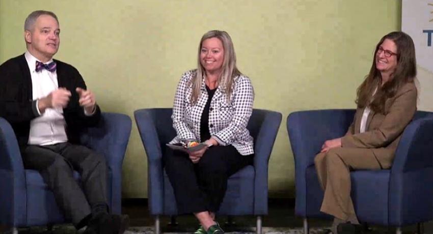 photo of three leadership members talking while sitting together