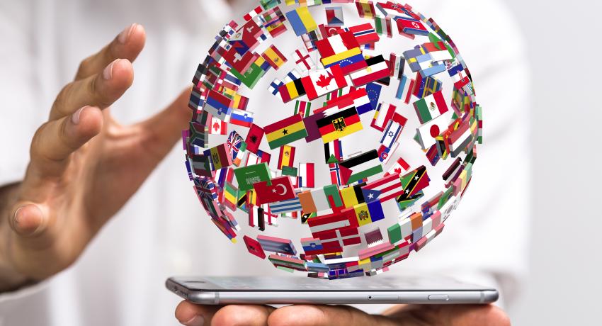 Sphere of flags above a tablet. 