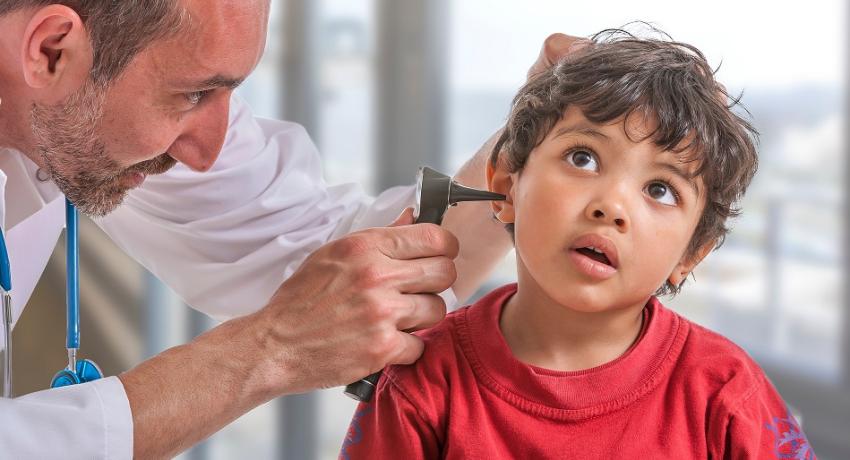 Dr. with stethoscope and child